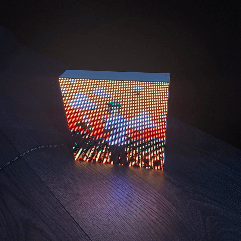 Miniature retro television showing Spotify album art