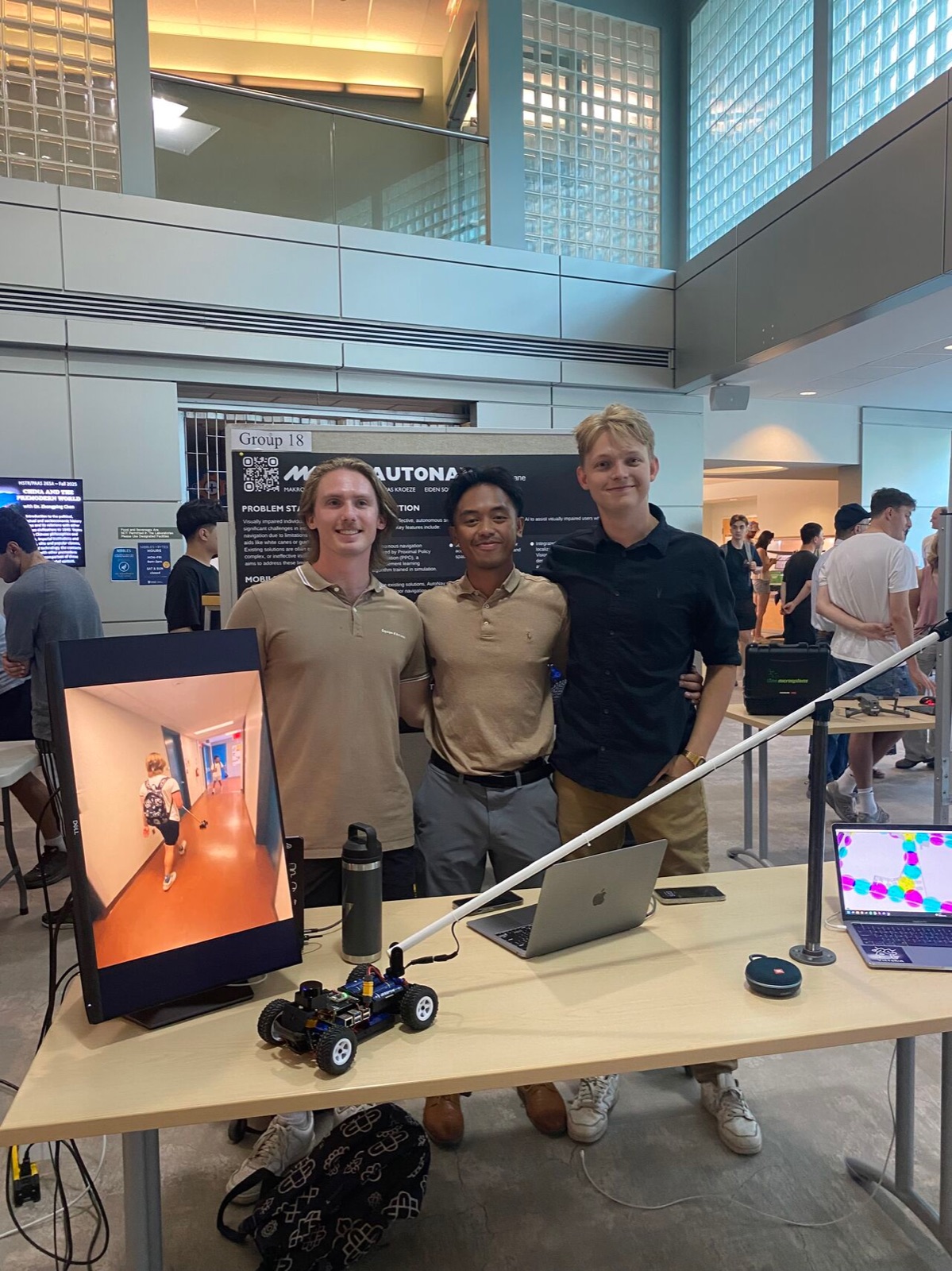 The AutoNav capstone team presenting their autonomous smart-cane prototype at the UVic ECE capstone competition