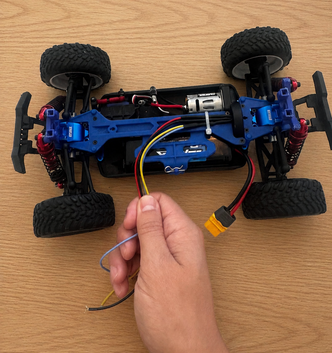 Original RC chassis during drivetrain development with wheel-encoder wiring visible